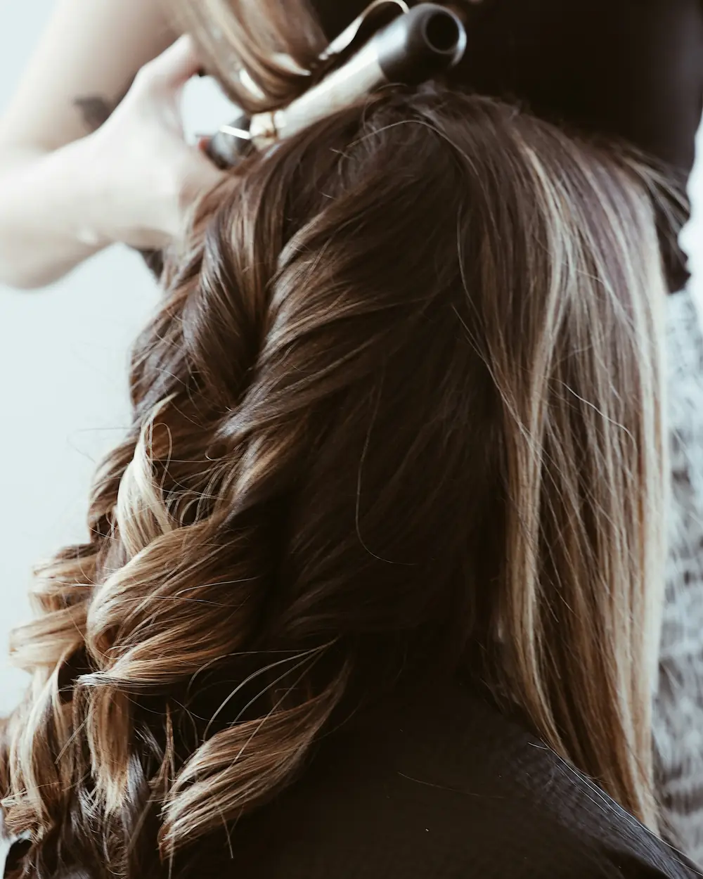 Soft brunette waves with hand-painted caramel lengths
