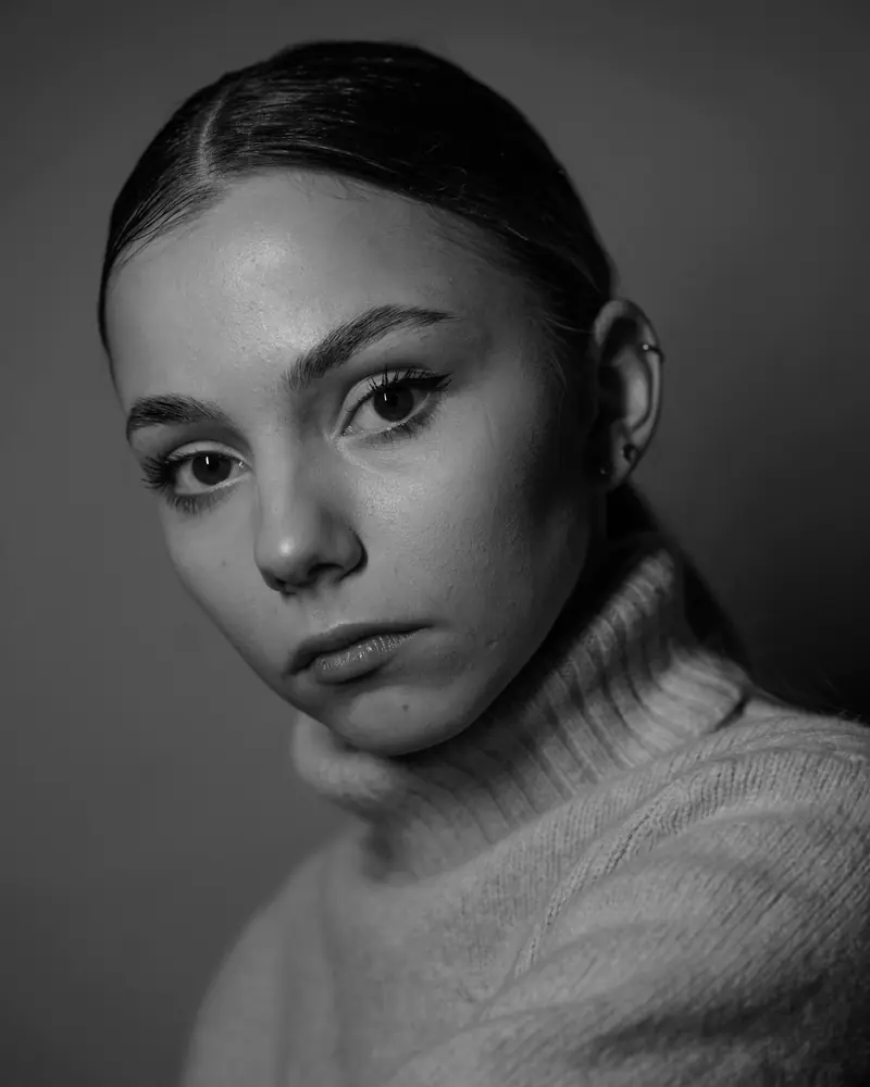 Morven Kerr, hair tied back, in a pale roll-neck